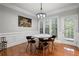 Dining area features wood floors, white molding and a round table under modern light fixture at 2873 Overlook Ne Way, Atlanta, GA 30324