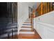 Welcoming entryway featuring hardwood floors, decorative moldings, and a staircase with an iron railing at 2873 Overlook Ne Way, Atlanta, GA 30324