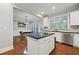 Modern kitchen with white cabinets, dark countertops, stainless steel appliances, and hardwood floors at 2873 Overlook Ne Way, Atlanta, GA 30324