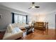 Bright and spacious living room with hardwood floors, a white sectional, and a large window at 2873 Overlook Ne Way, Atlanta, GA 30324