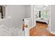 Bedroom with decorative staircase, hardwood floors and bright window light at 2873 Overlook Ne Way, Atlanta, GA 30324