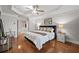 Bright main bedroom with tray ceiling, fan, hardwood floors and ensuite access at 2873 Overlook Ne Way, Atlanta, GA 30324