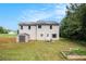 The home's backyard offers a shed, garden and lush green space for relaxing and entertaining at 45 Ratliff Dr, Covington, GA 30016
