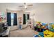 Cozy room features a ceiling fan, a large window, and carpeted floors at 45 Ratliff Dr, Covington, GA 30016