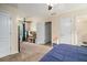 Bedroom with a view to an adjacent sitting area, and including multiple interior doors for easy access at 45 Ratliff Dr, Covington, GA 30016