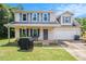 Charming two-story home with a covered front porch and a well-maintained lawn at 45 Ratliff Dr, Covington, GA 30016