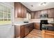 Kitchen featuring ample cabinet space, wood-look flooring, and exterior door at 45 Ratliff Dr, Covington, GA 30016