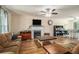 Cozy living room with fireplace, ceiling fan, and wood-look flooring at 45 Ratliff Dr, Covington, GA 30016