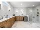 Elegant primary bathroom features marble floors, double vanity and a large glass shower at 604 Southland Pass, Canton, GA 30115