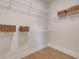 Walk-in closet features wire shelving and baskets for organized storage at 604 Southland Pass, Canton, GA 30115