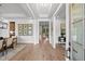 Bright foyer with hardwood floors leading into a dining room and living spaces at 604 Southland Pass, Canton, GA 30115