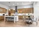 Bright, spacious kitchen features a large island, stainless steel appliances, and modern pendant lighting at 604 Southland Pass, Canton, GA 30115