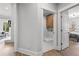 View of the laundry room next to the bedroom featuring white walls and a laundry sink at 604 Southland Pass, Canton, GA 30115