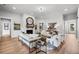 Bright living room featuring modern decor, a fireplace, and open access to other rooms at 604 Southland Pass, Canton, GA 30115