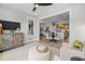Comfortable living room with modern furniture, a large TV, and an open view to the kitchen at 604 Southland Pass, Canton, GA 30115