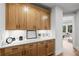 Home office features custom wooden cabinets, quartz countertops, and decor at 604 Southland Pass, Canton, GA 30115