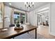 Bright home office features modern lighting, a wood desk, and seamless access to the dining room at 604 Southland Pass, Canton, GA 30115