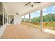 Spacious covered porch with wooden railing, providing an inviting outdoor living space at 604 Southland Pass, Canton, GA 30115