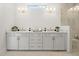 Elegant bathroom with double sinks, modern lighting, and luxurious countertop space at 608 Southland Pass, Canton, GA 30115