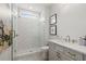 Elegant bathroom featuring a tiled shower with glass door and a modern vanity at 608 Southland Pass, Canton, GA 30115
