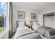 Shared bedroom featuring a closet, twin beds, and a window showcasing a scenic outdoor view at 608 Southland Pass, Canton, GA 30115