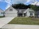 Charming single-story home featuring a two-car garage and well-manicured lawn at 608 Southland Pass, Canton, GA 30115
