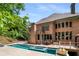 Stunning backyard with pool, spa, fire pit and large deck for entertaining with lots of privacy at 908 Basingstoke Ct, Suwanee, GA 30024