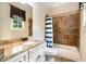 Bathroom with granite countertops, shower-tub, and tile flooring at 908 Basingstoke Ct, Suwanee, GA 30024