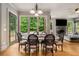 Bright dining area features views of the trees, access to the exterior, and is open to the living area at 908 Basingstoke Ct, Suwanee, GA 30024
