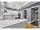 Kitchen featuring granite countertops, a white island, stainless steel appliances, and hardwood floors at 908 Basingstoke Ct, Suwanee, GA 30024
