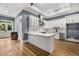 Kitchen featuring granite countertops, a white island, stainless steel appliances, and hardwood floors at 908 Basingstoke Ct, Suwanee, GA 30024
