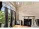 Elegant living room with fireplace, hardwood floors, and bright natural light at 908 Basingstoke Ct, Suwanee, GA 30024