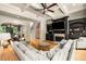Open living room features a fireplace, hardwood floors, and plenty of natural light at 908 Basingstoke Ct, Suwanee, GA 30024