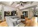 Spacious living room features hardwood floors, decorative columns and a partial view of the kitchen at 908 Basingstoke Ct, Suwanee, GA 30024