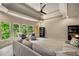 Spacious living room with large windows, tray ceilings, and a cozy atmosphere at 908 Basingstoke Ct, Suwanee, GA 30024