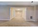 Finished basement area with neutral carpeting and fresh paint ready for a new owner at 1041 Flat Rock Rd, Covington, GA 30014