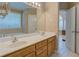 Bathroom features double sinks, white countertops, and leads to the bedroom and sunlit living room at 1041 Flat Rock Rd, Covington, GA 30014