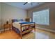 Charming bedroom with a ceiling fan, hardwood floors, and a bright window at 1041 Flat Rock Rd, Covington, GA 30014