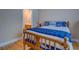 Comfortable bedroom featuring a cozy bed, hardwood floors, and ample natural light at 1041 Flat Rock Rd, Covington, GA 30014