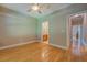 Spacious bedroom boasts hardwood floors, ceiling fan, and access to bath at 1041 Flat Rock Rd, Covington, GA 30014