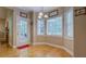Charming breakfast nook with hardwood floors and lots of windows with view to the yard at 1041 Flat Rock Rd, Covington, GA 30014