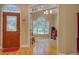 Inviting entryway with hardwood floors, decorative door, and arched window leading to living area at 1041 Flat Rock Rd, Covington, GA 30014