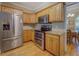 Spacious kitchen with stainless steel appliances, wooden cabinets, and granite countertops at 1041 Flat Rock Rd, Covington, GA 30014