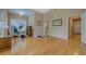 Large, sunlit living room features hardwood floors, offering versatile space for living and fitness at 1041 Flat Rock Rd, Covington, GA 30014