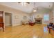 Spacious living room with hardwood floors, fireplace, and vaulted ceilings with ceiling fans at 1041 Flat Rock Rd, Covington, GA 30014
