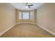 Cozy room featuring neutral walls, carpeting and a bay window to let the sunshine in at 1041 Flat Rock Rd, Covington, GA 30014
