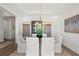 Contemporary dining room with stylish chandelier, decor, and ample natural light at 314 Brooke View Trail, Canton, GA 30115