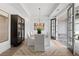 Elegant dining room with modern chandelier, stylish cabinet and access to the outdoor patio at 314 Brooke View Trail, Canton, GA 30115