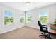 Bright bedroom featuring three large windows and neutral carpeting, perfect for a home office setup at 350 Provenance Dr, Atlanta, GA 30328