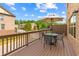 Cozy deck furnished with a dining set and shade umbrella, ideal for outdoor relaxation and entertainment at 350 Provenance Dr, Atlanta, GA 30328